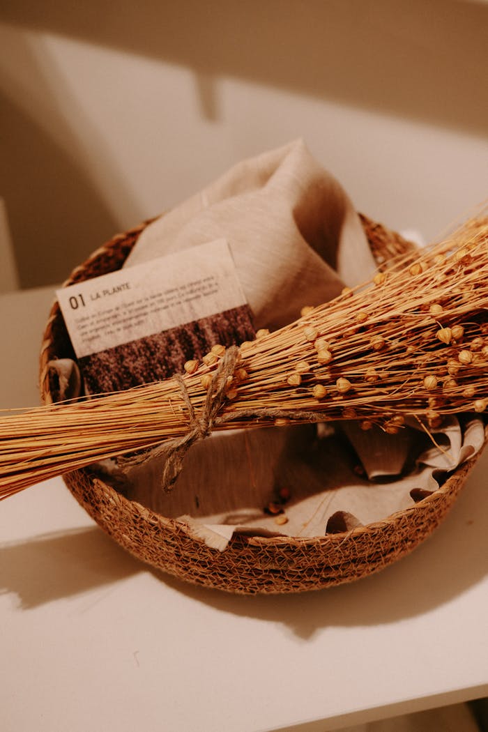 A rustic basket adorned with dried flowers and fabric, creating a cozy atmosphere.