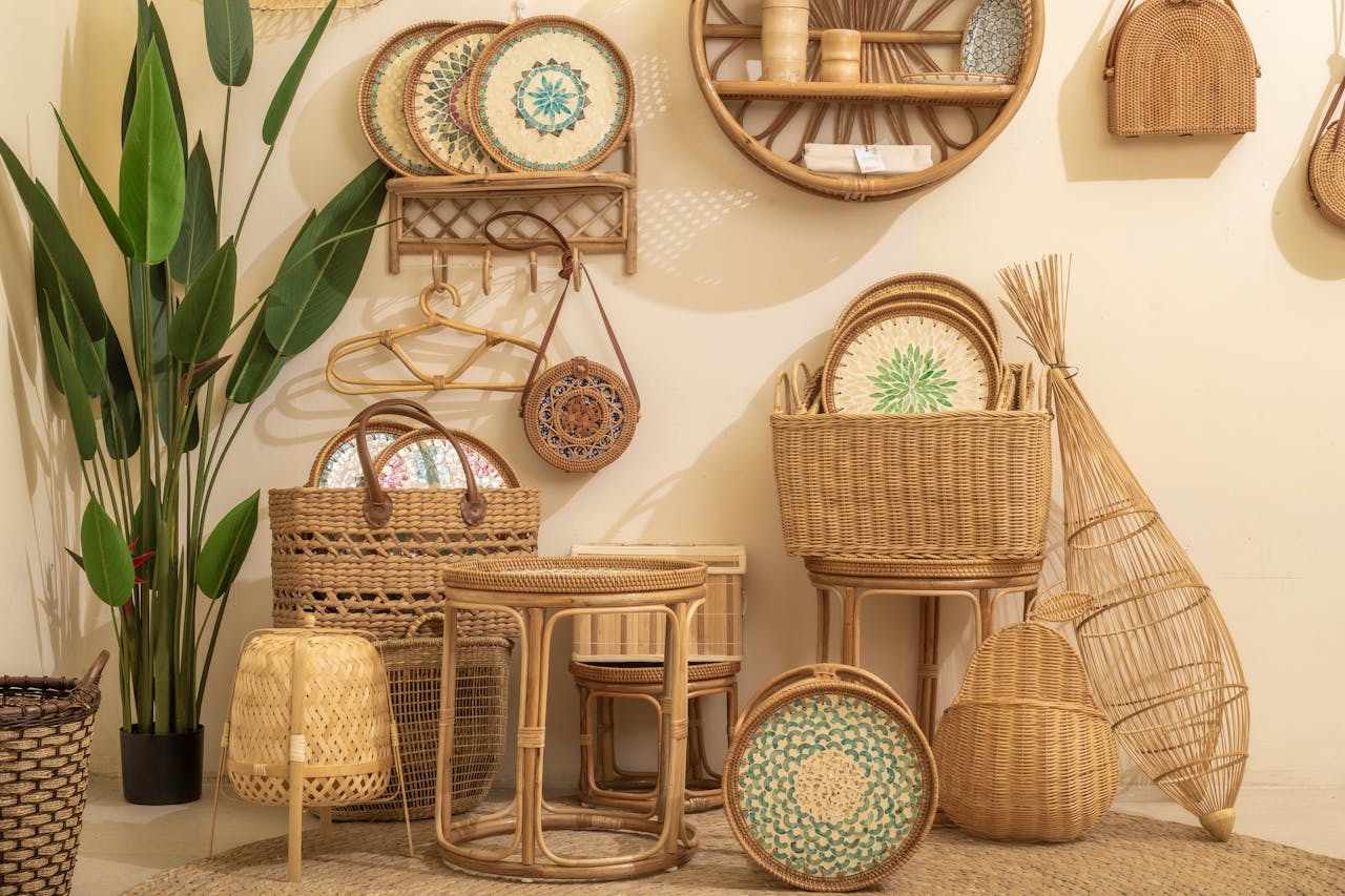 Cozy arrangement of wicker and rattan furniture with greenery indoors.